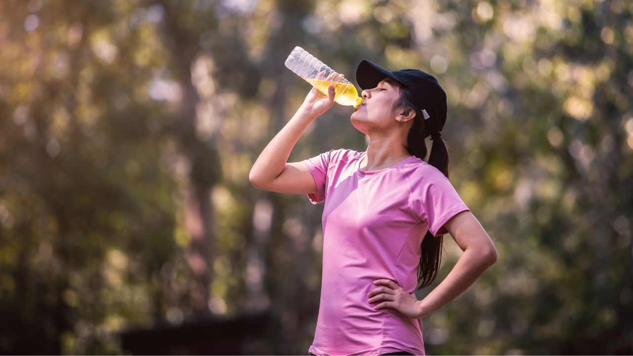 The Best Electrolyte Supplements for Post Workout Hydration by pilatesbodybykayla woman taking a drink