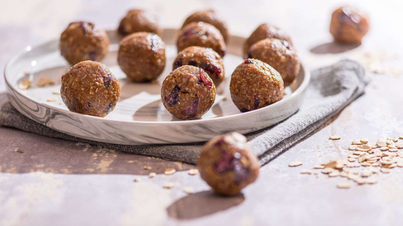 No bake protein balls on a decorative plate.