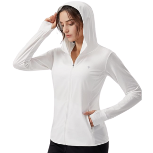 A woman wearing a white UPF 50+ long sleeve sun shirt.