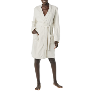 Bath Robe A woman wearing a white lightweight bathrobe.