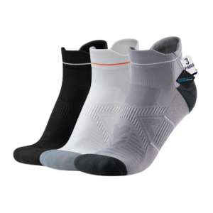 Set of three compression ankle socks, black, white, and gray.