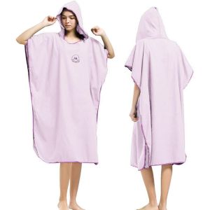 Quick-dry Poncho A woman wearing a pink quick-dry poncho.