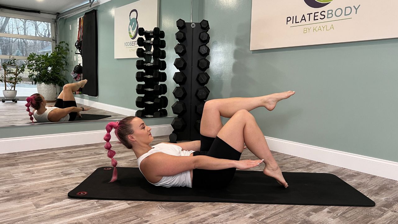 Hot mat Pilates Pilatesbody by Kayla doing hot mat Pilates in her studio.