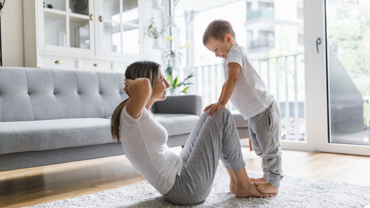 Workouts for Busy Moms A woman and child showing how workouts for busy moms can fit into a full schedule.