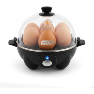 A hard boiled egg maker with seven eggs inside.