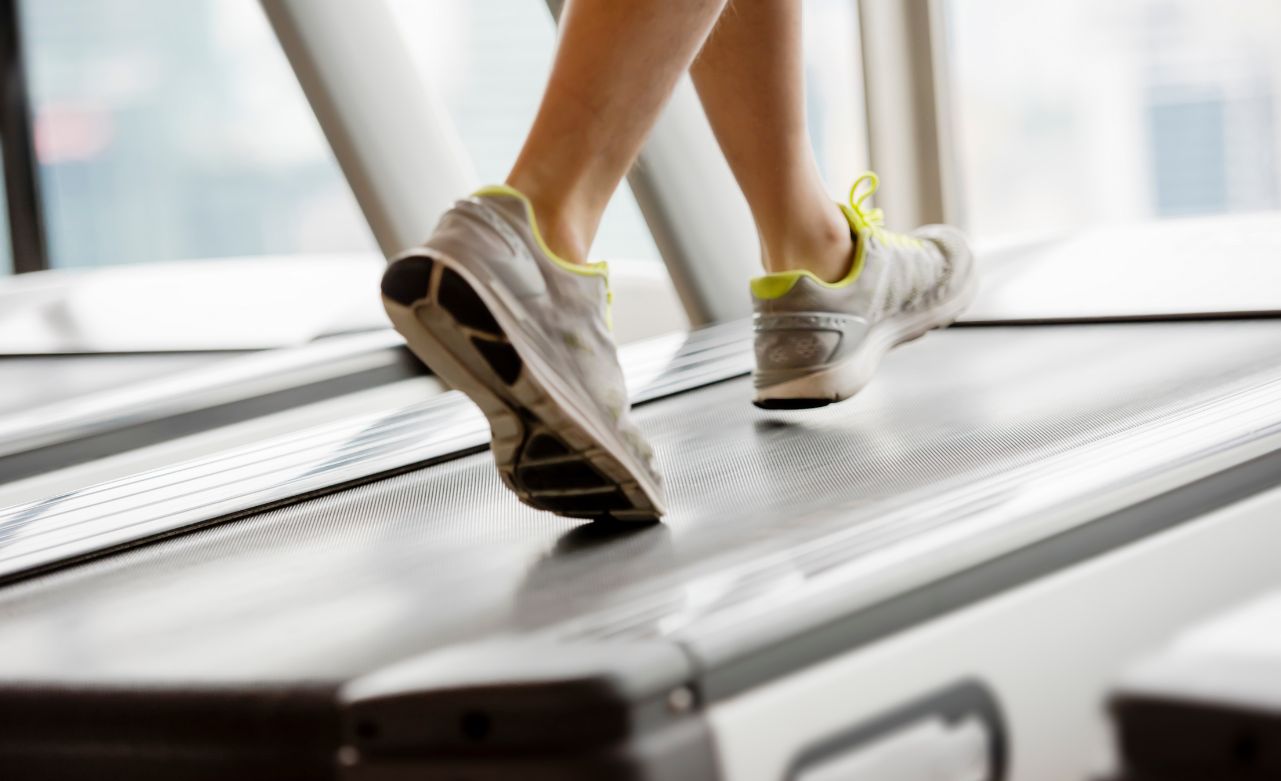 woman-on-incline-treadmill A woman on an incline treadmill showing how to improve cardiovascular endurance.